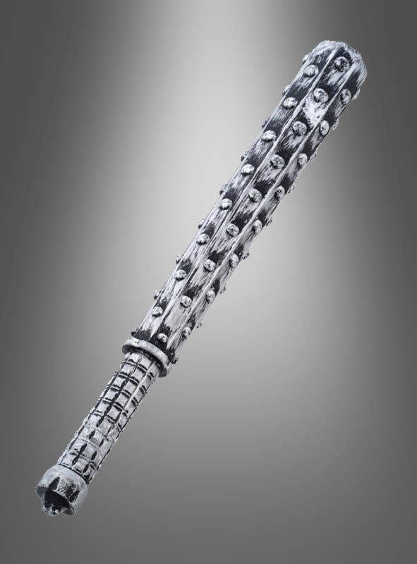 Ein „Knüppel Metalloptik 41 cm“ wird vor einem einfarbigen Hintergrund mit Farbverlauf gezeigt. Er verfügt über einen strukturierten Griff und Reihen metallischer Stacheln entlang seiner gesamten Länge – damit ist er die perfekte Halloween-Waffe oder das ideale Accessoire für dein Zombie-Kostüm.