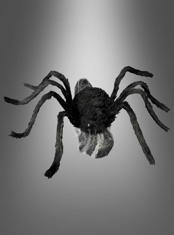 Eine springende Spinne (70 x 50 cm) in Schwarz mit acht Beinen und sichtbaren Fangzähnen wird vor einem grauen Farbverlauf präsentiert – ideal als Halloween-Dekoration oder für deine eigene Inszenierung mit einer animierten Riesenspinne.