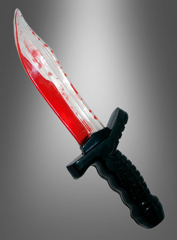 Ein „Blutender Dolch“ – ein Messer mit schwarzem Griff und silberner Klinge, die durch rote Spritzer wie Blut aussieht – ist das perfekte Accessoire für jedes Horrorfilm-Kostüm – präsentiert vor einem grauen Hintergrund mit Farbverlauf.