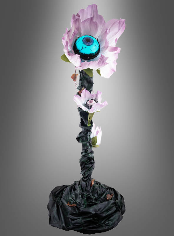 Mit einer Höhe von 180 cm besticht die „Animierte Blume mit Augen“-Dekoration durch eine auffällige Kunstblume mit einem großen blauen Augapfel in der Mitte, einem gewundenen dunklen Stiel und kleineren Blüten – damit ist sie die ultimative gruselige Pflanze für Ihre nächste Halloween-Dekoration. Vor einem grauen Hintergrund mit Farbverlauf verleiht diese unheimliche Kreation jeder gruseligen Kulisse einen beunruhigenden Charme.