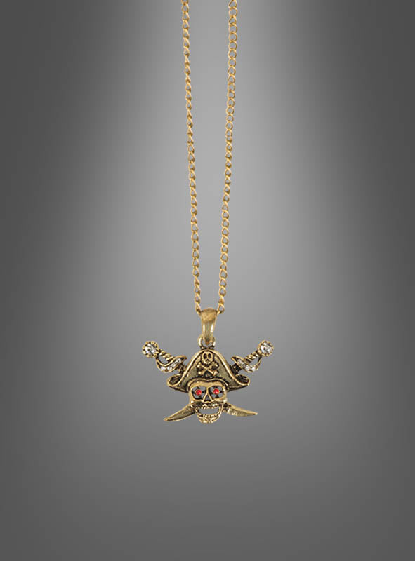 Goldfarbene „Piraten-Totenkopf-Kette“ mit einem Anhänger in Form eines Piratenschädels mit gekreuzten Knochen, leuchtend roten Edelsteinaugen und einem schwarzen Piratenhut – vor einem grauen Farbverlauf. Ein auffälliges Piratenschmuckstück, ideal zur Vervollständigung deines Seeräuberbraut-Kostüms.