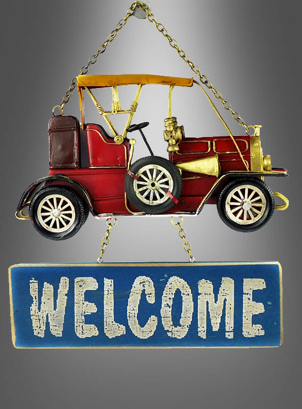 Über dem Türschild „20er Jahre Oldtimer Willkommen 30 cm“ ist ein Metallornament in Form eines roten Oldtimers angebracht; dabei handelt es sich um ein blaues, rechteckiges Blechschild, auf dem das Wort „WILLKOMMEN“ in weißer Schrift mit Used-Look zu lesen ist.