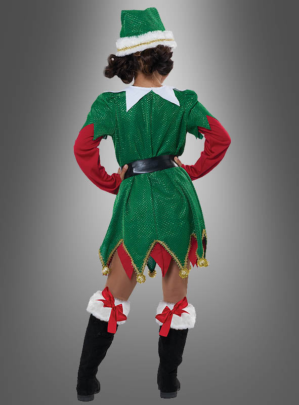 Eine Person, die das „Süße Weihnachtselfe“-Kinderkostüm trägt – bestehend aus einem grün-roten Elfenoutfit mit Mütze, schwarzen Stiefeln und roten Schleifen –, steht mit dem Rücken zur Kamera vor einem grau verlaufenden Hintergrund und verkörpert damit perfekt die festliche Stimmung für jede Weihnachtsfeier.
