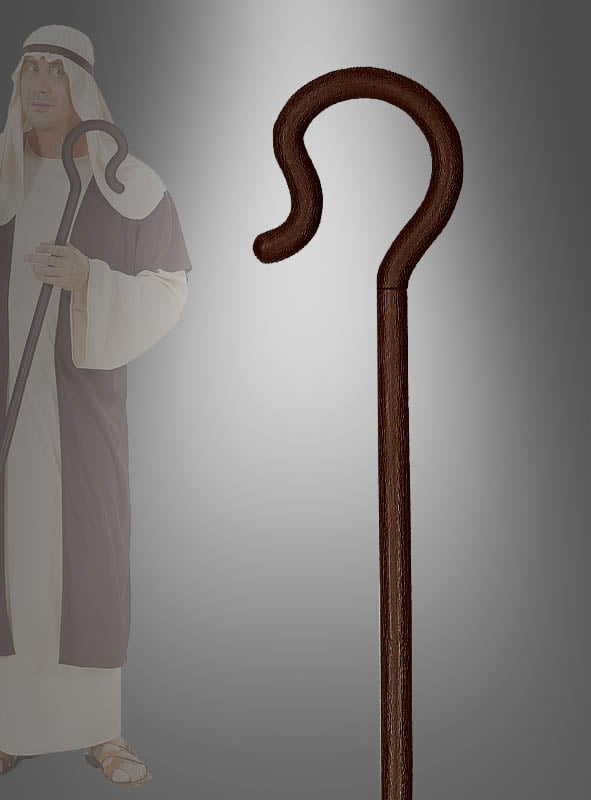 Im Mittelpunkt steht ein weißer oder brauner Hirtenstab, während im Hintergrund eine Person in traditioneller Schäfertracht und mit Kopfbedeckung einen passenden Stab in der Hand hält – ideal für Krippenspiele und festliche Nachstellungen.
