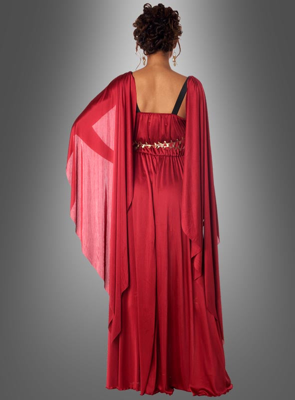 Eine Person, von hinten gesehen, die das „Griechische Göttin der Morgenröte Eos“ trägt – ein langes, rotes, drapiertes Kleid, das von einem Kleid einer griechischen Göttin inspiriert und mit einem Ziergürtel verziert ist –, vor einem schlichten grauen Hintergrund.