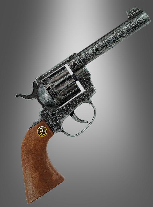 Ein Revolver im Magnum-Antik-Look aus Metall mit silberfarbener Oberfläche, verziert mit kunstvollen Gravuren und einem Holzgriff, präsentiert vor einem grau verlaufenden Hintergrund.