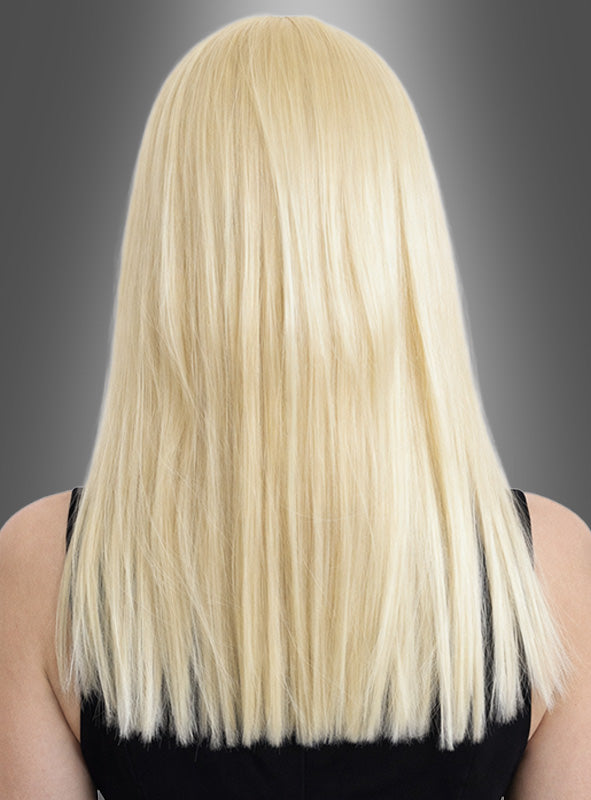 Person mit glattem, schulterlangem „Glamour“-Haar mit Pony in Platinblond, von hinten vor einem grau verlaufenden Hintergrund abgebildet.