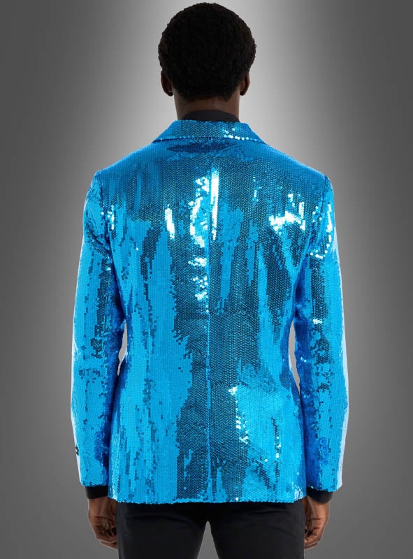 Eine Person, die die „Paillettenjacke Herren blau“ trägt, steht mit dem Rücken zur Kamera vor einem grau verlaufenden Hintergrund.