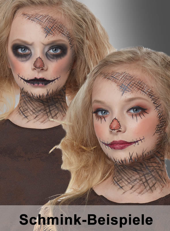 Zwei Mädchen mit hellem Haar tragen ein Vogelscheuchen-Make-up mit aufgestickten Motiven im Gesicht und am Hals. Dieses Vogelscheuchen-Kostüm mit Sense eignet sich perfekt als Inspiration für eine gruselige Verkleidung und hebt sich deutlich von einem grau gestreiften Hintergrund ab. Unten ist der Text „Schmink-Beispiele“ zu sehen.