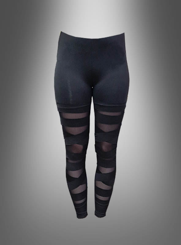 Die schwarzen „Deluxe Schlitz“-Leggings im 80er-Jahre-Stil mit hohem Bund zeichnen sich durch transparente Mesh-Streifen an den Oberschenkeln und Waden aus, inspiriert vom Bandagen-Look-Trend. Diese schwarzen Damen-Leggings zeichnen sich durch elegante, transparente Details aus und sorgen auf einem schlichten Farbverlaufshintergrund für einen modernen, stilvollen Auftritt.