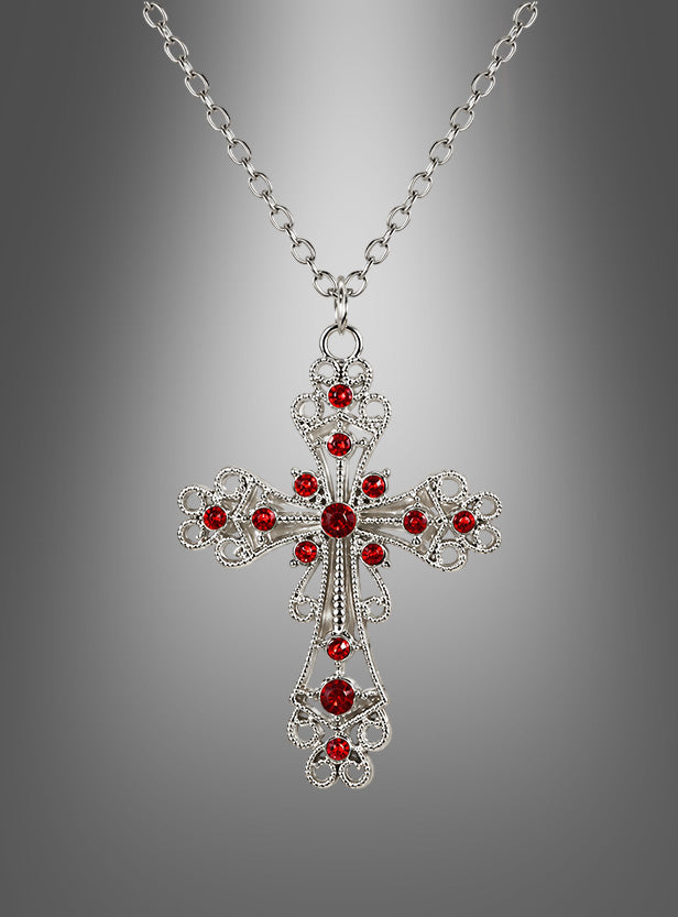 Eine Halskette mit dem Anhänger „Kreuz Kette mit roten Steinen“, die sich durch leuchtend rote Steine auszeichnet und vor einem sanften grauen Farbverlauf zur Geltung kommt, verkörpert die raffinierte Eleganz von Mittelalter Schmuck.