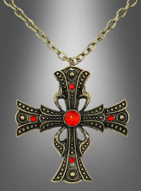 Die „Vampir Kette Gothic Kreuz aus Metall 6,5 cm“ besticht durch einen kunstvoll gearbeiteten schwarz-goldenen Anhänger, der mit leuchtend roten Edelsteinen verziert ist und sich vor einem grau abgestuften Hintergrund abhebt – ein dramatisches Statement-Stück für Liebhaber des markanten Gothic-Stils.