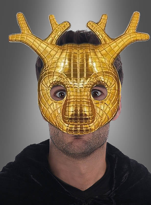 Eine Person, die die goldene „Squad Game VIP“-Maske „Hirsch“ trägt, die sich durch glänzendes Geweih und tierähnliche Details auszeichnet, vor einem grauen Hintergrund mit Farbverlauf.