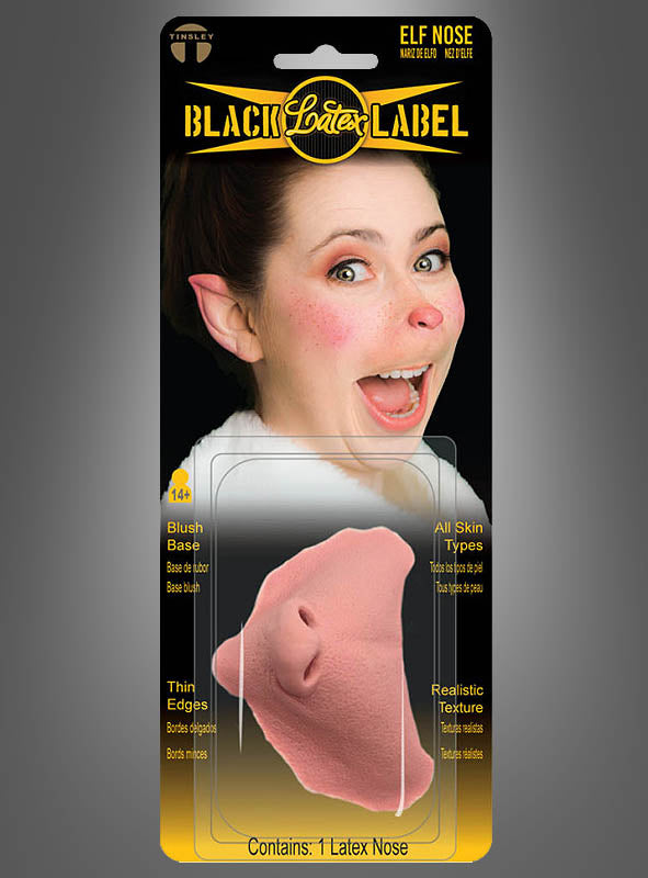 Abgebildet ist ein verpacktes Kostümzubehör von Elfen Nase Latex FX Tinsley Transfers, auf dessen Verpackung ein Foto einer lächelnden Frau zu sehen ist, die die Nase und die spitzen Ohren trägt. Diese realistische Latex-Prothese eignet sich ideal, um sich in einen Weihnachtself zu verwandeln, und verleiht jedem festlichen Outfit einen Hauch von Magie.