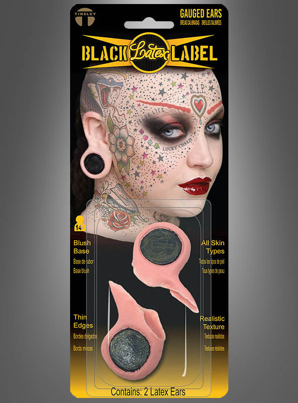 Kunststoffverpackung mit zwei „Flesh Plug Ohrläppchen Loch Tinsley Transfers“ – Latex-Ohrprothesen für gedehnte Ohrläppchen, ideal als Flesh-Tunnel-Imitate – mit einem Beispielbild eines stark tätowierten und gepiercten Models, perfekt zur Vervollständigung Ihres 90er-Jahre-Kostüms.