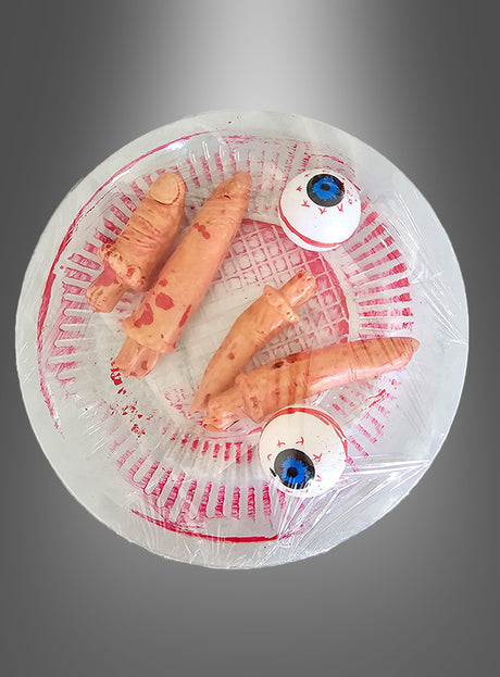 Die „Halloween-Deko Finger-Augen“ bestehen aus einer durchsichtigen Plastikplatte mit blutigen Fingern und zwei künstlichen Augäpfeln, die alle in Plastik verpackt sind – damit sind sie das perfekte gruselige Accessoire für Ihre Halloween-Deko vor einem grauen Hintergrund mit Farbverlauf.
