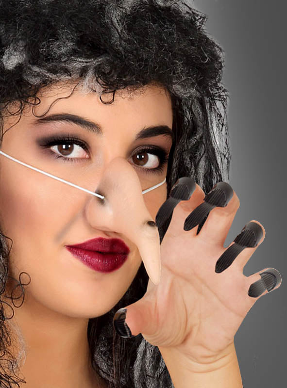 Diese Person mit dunklem Lockenhaar und rotem Lippenstift trägt das Set „Hexennase und Krallen“ – bestehend aus einer langen künstlichen Hexennase und schwarzen, klauenartigen Fingerverlängerungen – und posiert dramatisch, wobei sie eine Hand nahe an ihr Gesicht hebt, ganz im Stil ihres bezaubernden Kostüms.