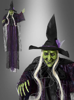 Die „Grüne Hexe“ 130 cm Halloween-Hängedekoration – eine lebensgroße Halloween-Hexendekoration – hat ein grünes Gesicht, langes weißes Haar, einen schwarzen Hut und einen schwarz-lila Umhang. Diese Hexendekoration, die sowohl in Gesamtansicht als auch in Nahaufnahme abgebildet ist, verleiht Ihren Grusel-Feierlichkeiten eine unheimliche Note.
