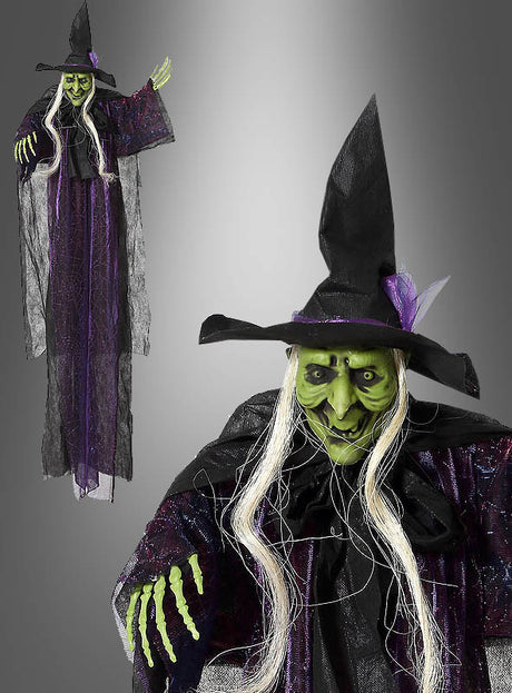 Die „Grüne Hexe“ 130 cm Halloween-Hängedekoration – eine lebensgroße Halloween-Hexendekoration – hat ein grünes Gesicht, langes weißes Haar, einen schwarzen Hut und einen schwarz-lila Umhang. Diese Hexendekoration, die sowohl in Gesamtansicht als auch in Nahaufnahme abgebildet ist, verleiht Ihren Grusel-Feierlichkeiten eine unheimliche Note.