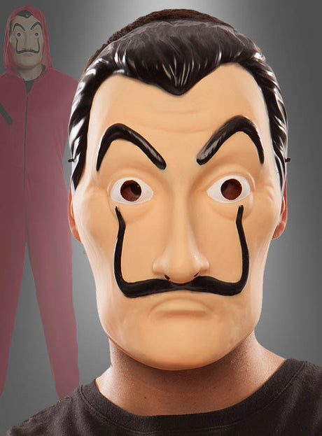 Im Vordergrund eine Person, die eine „Haus des Geldes“-Maske „Dali“ für Erwachsene trägt, im Hintergrund eine weitere Person in einem roten Overall mit Kapuze und derselben Maske.