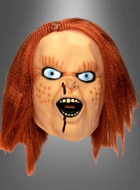 Die Horrorfilm-Maske „Mörderpuppe“ zeigt rote Haare, blaue Augen und Sommersprossen sowie einen wütenden Gesichtsausdruck, einen offenen Mund, der die Zähne entblößt, und einen Blutstreifen, der aus der Nase läuft. Als Latex-Vollmaske gefertigt, eignet sie sich perfekt für Horror-Kostüme oder Sammlungen und sorgt für eine Extraportion Grusel.