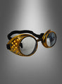 Ein Paar goldene Steampunk-Schweißerbrillen mit runden, klaren Gläsern im Vintage-Stil, einem schwarzen Riemen und strukturierten Seitenteilen – perfekt als Steampunk-Brille oder als Blickfang für Ihr Steampunk-Kostüm – präsentiert vor einem grauen Hintergrund mit Farbverlauf.