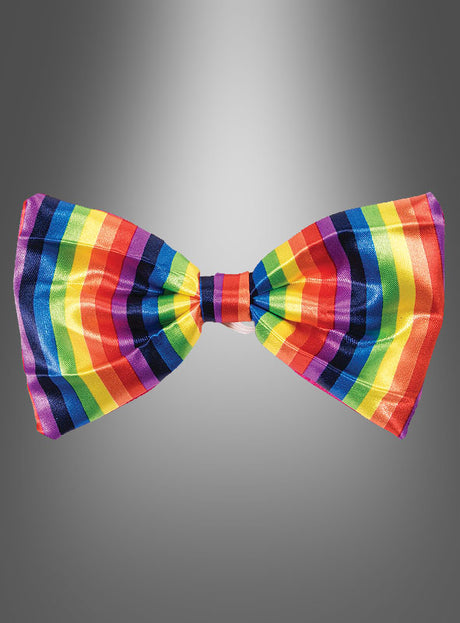 Eine bunte Fliege für ein Clownkostüm mit Regenbogenstreifen vor einem grauen Farbverlaufshintergrund – ideal als fröhliches Karnevalsaccessoire oder um jedem Clownkostüm eine verspielte Note zu verleihen.