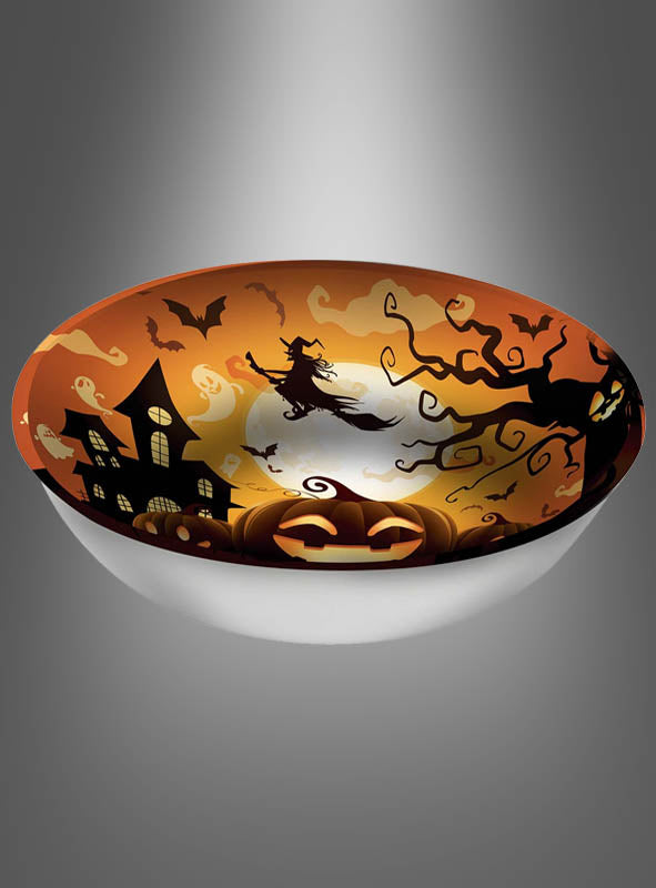 Die XXL-Kürbisschale „Halloween“ (31 cm) besticht durch ein festliches Design mit einer Hexe auf einem Besen, Fledermäusen, einem Spukhaus, unheimlichen Bäumen und einer leuchtenden Kürbislaterne vor einem orangefarbenen Himmel. Perfekt als Halloween-Snackschale zum Servieren von Leckereien oder zum Präsentieren Ihrer liebsten Festtags-Süßigkeiten.
