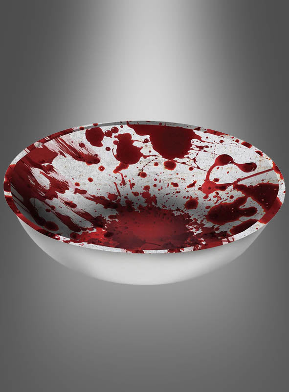 Eine XXL „Blutige Snackschale“ (31 cm), gefüllt mit roter Flüssigkeit, die so verspritzt und verteilt ist, dass sie wie Blut aussieht, steht vor einem schlichten grauen Hintergrund – perfekt als blutige Halloween-Schale für Ihre Vampir-Zombie-Party oder als auffällige Halloween-Tischdekoration.