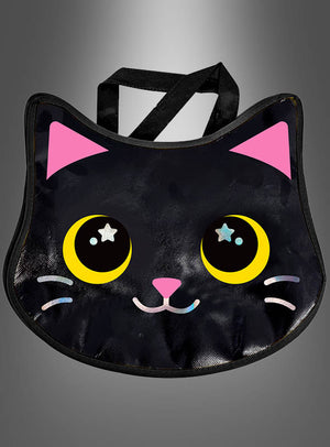 Die „Halloween-Handtasche süße Katze“ ist eine schwarze Tragetasche in Form eines Katzengesichts mit großen gelben Augen mit sternförmigen Akzenten, rosa Ohren und einem lächelnden Mund – ideal als Katzen-Tasche für Halloween oder als Kostüm-Accessoire für Kinder – vor einem grau verlaufenden Hintergrund.