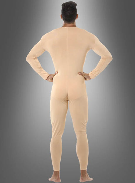 Eine Person steht barfuß mit dem Rücken zur Kamera und trägt einen eng anliegenden hautfarbenen Overall – einen eleganten Ganzkörperanzug für Erwachsene – vor einem grauen Hintergrund mit Farbverlauf.