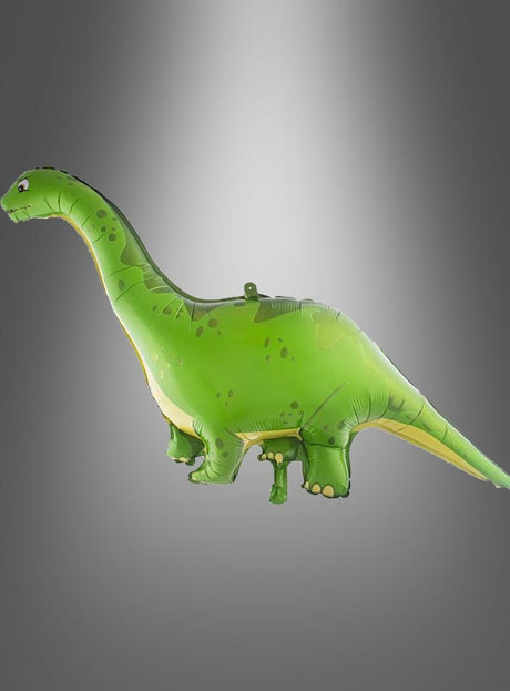 Ein grüner Dinosaurier-Folienballon (63,2 x 129 cm) in Form eines Sauropoden schwebt vor einem grauen Hintergrund mit Farbverlauf – perfekt als Dekoration für den nächsten Kindergeburtstag.