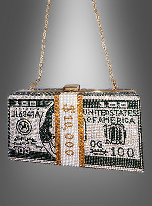 Wir präsentieren die „Dollar Handtasche Deluxe mit Strass“ – eine atemberaubende, mit Perlen verzierte Clutch, die einem Stapel von 10.000 US-Dollar in 100-Dollar-Scheinen nachempfunden ist und mit funkelnden Strasssteinen sowie einem goldenen Kettenriemen versehen ist. Vor einem grauen Hintergrund fotografiert, ist dieses auffällige Accessoire das ultimative Statement-Stück für jede mutige Fashionista.