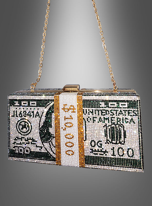 Wir präsentieren die „Dollar Handtasche Deluxe mit Strass“ – eine atemberaubende, mit Perlen verzierte Clutch, die einem Stapel von 10.000 US-Dollar in 100-Dollar-Scheinen nachempfunden ist und mit funkelnden Strasssteinen sowie einem goldenen Kettenriemen versehen ist. Vor einem grauen Hintergrund fotografiert, ist dieses auffällige Accessoire das ultimative Statement-Stück für jede mutige Fashionista.