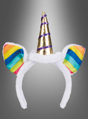 Der Einhorn-Haarreif mit Regenbogen-Ohren, weißem Fellbesatz, regenbogenfarbenen Ohren und einem glänzenden goldenen Einhornhorn mit violetten Akzenten ist das perfekte Accessoire, um dein Einhorn-Kostüm zu vervollständigen. Abgebildet vor einem grauen Hintergrund mit Farbverlauf.