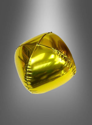 Ein glänzender, goldfarbener Folienballon in Würfelform schwebt vor einem grau verlaufenden Hintergrund.