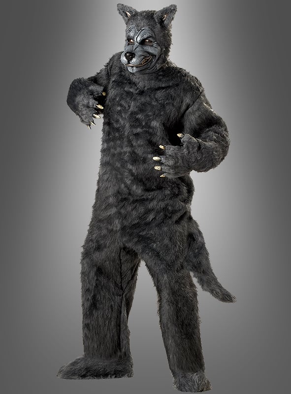 Eine Person trägt das „Böser Wolf“-Kostüm für Herren, ein graues, pelziges Ganzkörperkostüm mit Krallenhänden, einem Schwanz und einer Wolfsmaske, und steht vor einem einfarbigen Hintergrund mit Farbverlauf.