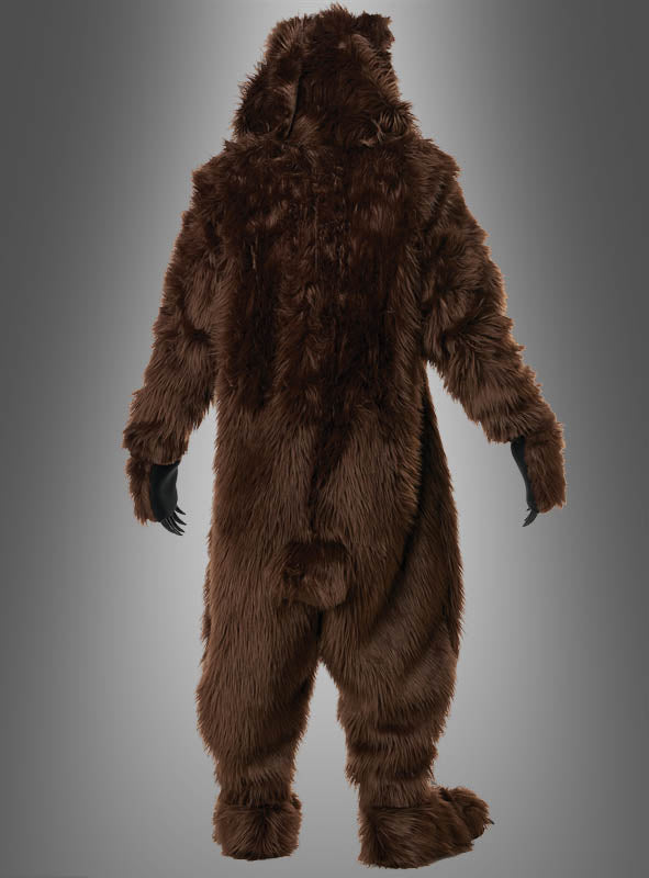 Eine Person, die das „Grizzly Bär Kostüm braun Deluxe“ mit Motion-Maske trägt, von hinten vor einem neutralen grauen Hintergrund. Die realistische Motion-Maske unterstreicht die lebensechte Optik dieses braunen Ganzkörperkostüms.