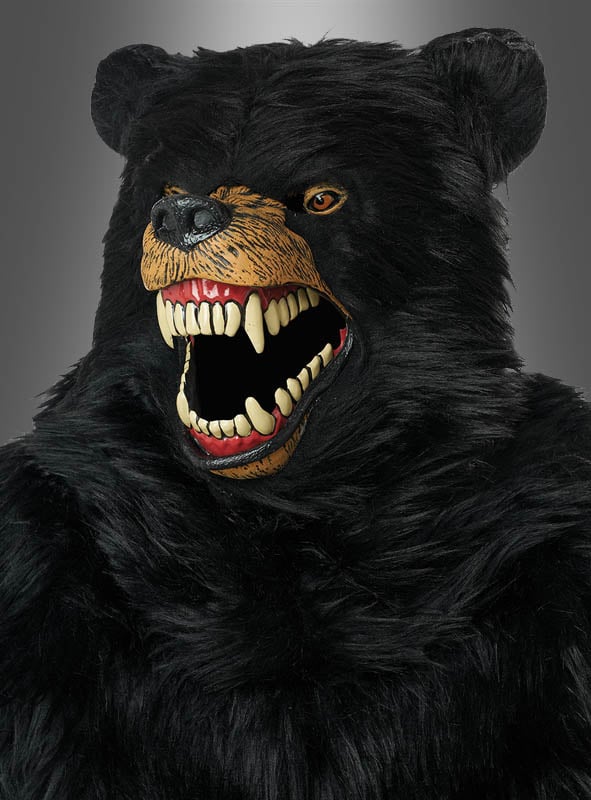 Eine Person, die das „Schwarzbär-Kostüm Deluxe mit Ani-Motion-Maske“ trägt, das sich durch übertrieben große Zähne und einen offenen Mund auszeichnet, vor einem neutralen Hintergrund.