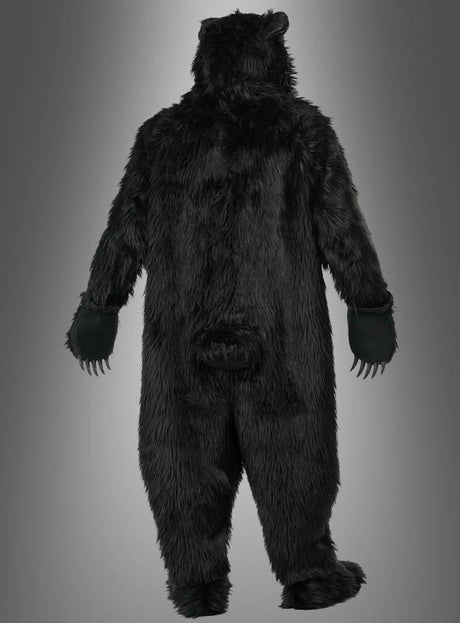 Eine Person, von hinten gesehen, die Arme leicht ausgestreckt, im „Schwarzbär-Kostüm Deluxe mit Ani-Motion-Maske“ vor einem grauen Hintergrund mit Farbverlauf.
