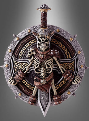 Ein dekoratives „Wikinger Schild und Schwert“ (48–58 cm) zeigt eine detailgetreue Skelettfigur in einer Rüstung im Wikinger-Stil, hinter der ein Schwert verläuft, während der Schild mit nordischen Mustern verziert ist – perfekt als Teil eines jeden Waffensets.