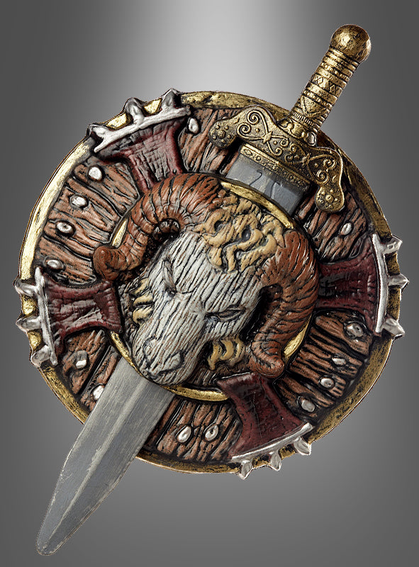 Entdecken Sie das „Fantasy-Schwert 48 cm und Schild“ – einen runden, kunstvoll verzierten Schild mit einem auffälligen Widderkopf- und Schwertmotiv, verziert mit goldenen, roten und silbernen Details vor einem grau verlaufenden Hintergrund. Ideal für Karnevalskostüme oder jede Veranstaltung zum Thema „Schwert und Schild“.