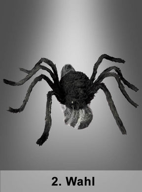 Eine schwarze, animierte Spinne mit den Maßen 70 x 50 cm („2. Wahl Springende Spinne“) und sichtbarem Spinnennetz ist vor einem grauen Hintergrund mit Farbverlauf zu sehen, wodurch eine gruselige Szene entsteht, die sich ideal für die Halloween-Dekoration eignet. Der Text „2. Wahl“ ist am unteren Bildrand zu sehen.