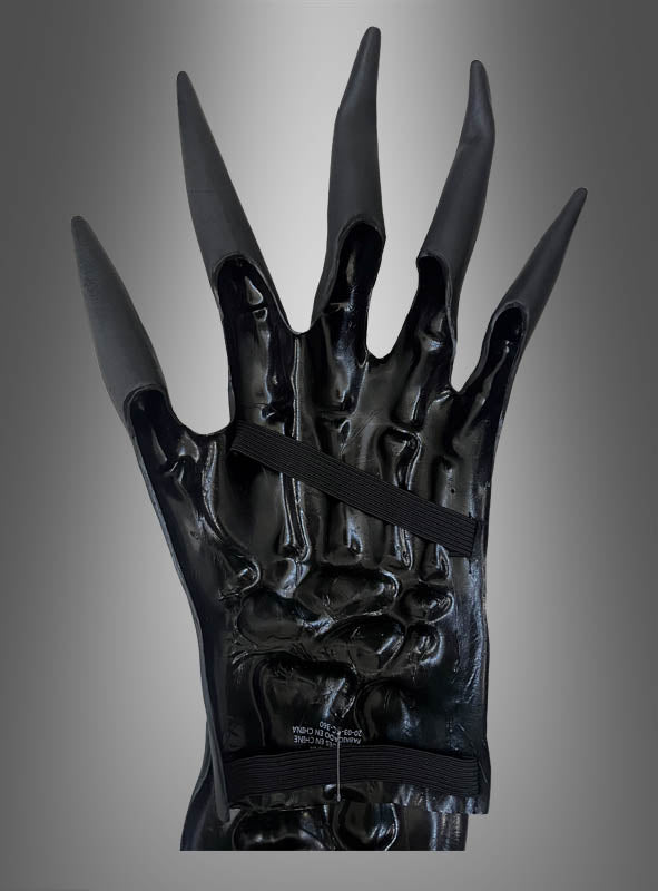 Ein Paar 3D-Skelett-Handschuhe mit Knochen aus Latex in glänzendem Schwarz, mit langen, spitzen Fingern und zwei horizontalen Riemen auf dem Handrücken, aufrecht vor einem grauen Hintergrund mit Farbverlauf präsentiert – ideal für Ihr Halloween-Kostüm oder als auffälliges Sensenmann-Accessoire.