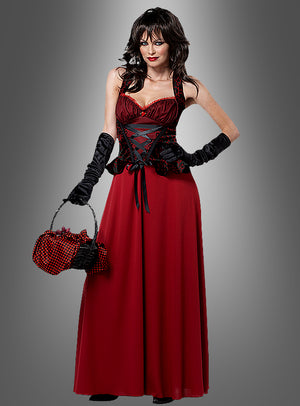 Eine Frau, die das „Rotkäppchen“-Kostüm 3-in-1 trägt – bestehend aus einem langen, sexy roten Kleid, kombiniert mit einem schwarzen Korsett und Handschuhen, und die eine rot-schwarze Handtasche in der Hand hält –, steht vor einem grauen Hintergrund mit Farbverlauf.