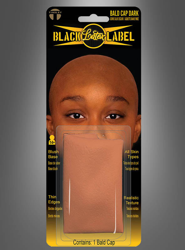 Verpackung mit einer Latex-Glatzenkappe „FX Film Glatze“ von Tinsley Transfers, beschriftet mit „Black Label Latex“ und mit einem Bild einer Person, die die Kappe trägt. Zu den hervorgehobenen Merkmalen gehören dünne Ränder, eine realistische Textur und die Eignung für alle Hauttypen.