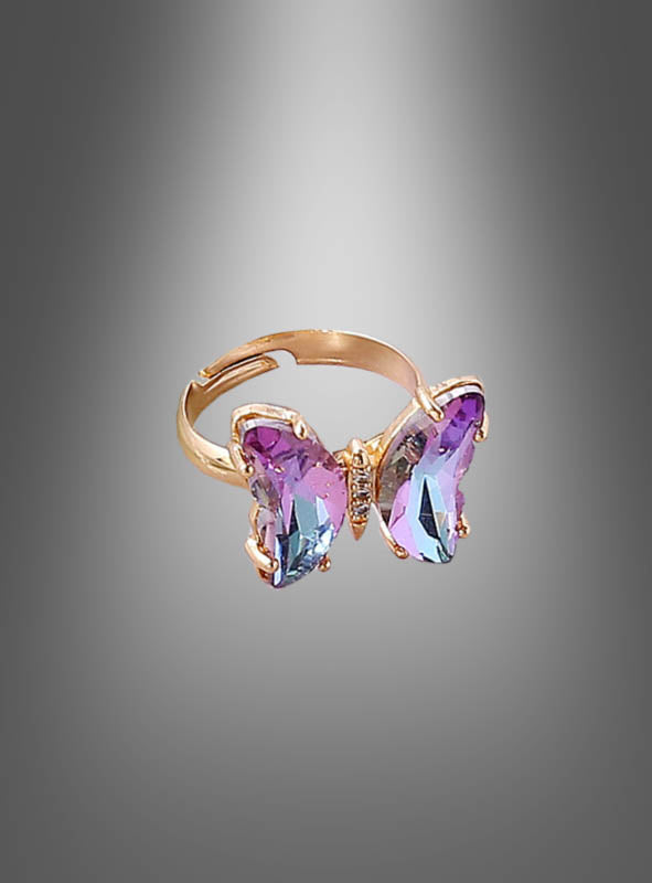 Wir präsentieren den „Verstellbaren Schmetterling-Ring aus Glas“ – einen atemberaubenden goldenen Ring, der mit einem aus zartem Glas gefertigten Schmetterlingsmotiv in Lila und Blau verziert ist. Vor einem eleganten grauen Hintergrund mit Farbverlauf präsentiert dieses Stück Kostümschmuck, das Frauen lieben werden, verleiht jedem Outfit mit seinen exquisiten Details aus Glas-Schmetterlingsschmuck einen einzigartigen Charme und Eleganz.