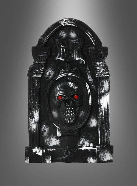 Das „Grabstein Halloween – Verschiedene Designs“-Set besteht aus einem schwarzen Grabstein-Requisit mit einem Totenkopf und leuchtend roten Augen, auf dessen Oberseite „RIP“ eingraviert ist, vor einem grauen Hintergrund mit Farbverlauf – perfekt als Halloween-Dekoration und als auffälliger Grabstein für Ihre gruselige Dekoration.