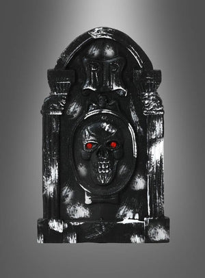 Grabstein Halloween – verschiedene Designs: ein schwarzer Grabstein mit einem Totenkopf und leuchtend roten Augen, versehen mit der Aufschrift „RIP“, fotografiert vor einem grauen Hintergrund mit Farbverlauf. Diese Halloween-Dekoration eignet sich perfekt für Ihre gruseligen Feierlichkeiten und verleiht jeder Spuk-Kulisse eine unheimliche Note.