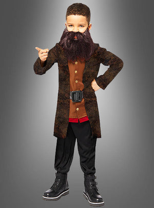 Ein Kind, das das Kinder-Hagrid-Kostüm aus Harry Potter trägt – bestehend aus einem braunen Mantel, einem Kunstbart, einer schwarzen Hose und Stiefeln –, nimmt eine selbstbewusste Pose ein: Eine Hand auf der Hüfte, die andere zeigt vor einem grauen Hintergrund mit Farbverlauf; ideal für junge Fans, die sich gerne authentisch als Hagrid aus der berühmten Zaubererwelt verkleiden möchten.